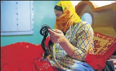  ?? WASEEM ANDRABI/HT ?? A woman displays her lock of hair that was chopped earlier this month in Srinagar.