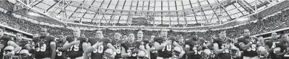  ?? BARRY CRONIN/GETTY IMAGES ?? The Navy football team lines up after a 50-10 loss against Notre Dame at Aviva Stadium in Dublin, Ireland, on Sept. 1, 2012. The schools have a contract to play each year until 2026.