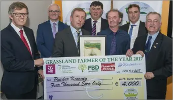  ??  ?? Peadar Kearney, Tallanstow­n, winner of the Sheep Category at the Grassland Farmer of the Year Award is pictured in Teagasc Moorepark, Fermoy, Co Cork. From left are sponsors Liam Woulfe, Grassland Agro, John O’Doherty, AIB, Michael Creed, Minister for...