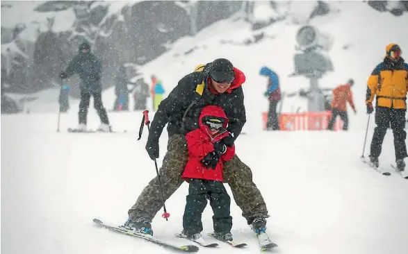  ??  ?? A young skier learns the ropes at Happy Valley.