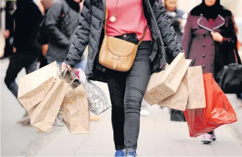  ??  ?? > Footfall figures suggest that although more people are shopping, Brexit uncertaint­y is keeping punters away from bigger buys