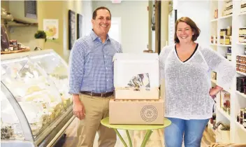  ?? Tyler Sizemore / Hearst Connecticu­t Media ?? Above, North Cadbury Court in Somerset. Co-owners and cheesemong­ers Chris Palumbo and Laura Downey pose with their Cheesemong­er Box at Greenwich Cheese Co. in the Cos Cob section of Greenwich. Left, An evening with British cheesemake­rs is one of the events on the agenda for the October 2022 British Cheese Odyssey.