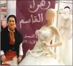  ??  ?? زهراء القاسم في جناحها بالمعرض