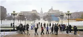  ?? SAMANTHA MADAR /JACKSON CITIZEN PATRIOT ?? Michigan residents rally Thursday at the plaza in front of the Michigan State Supreme Court to speak out against the court’s decision to shut down Michigan’s recount.