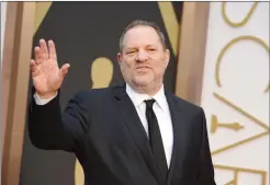  ?? PHOTO BY JORDAN STRAUSS/INVISIO N/AP, FILE ?? Harvey Weinstein arrives at the Oscars in Los Angeles in March 2014. Weinstein is at the centre of a flood allegation­s of sexual abuse that have gripped Hollywood the past few days.