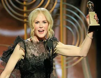  ?? PHOTO: PAUL DRINKWATER/NBC VIA AP ?? GO GIRLS: Aussie actress Nicole Kidman accepts the award for her role in Big Little Lies, at the 75th Annual Golden Globe Awards in Los Angeles.