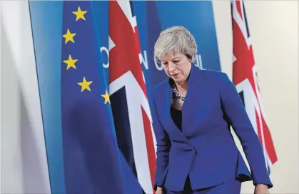  ?? SEAN GALLUP GETTY IMAGES ?? Britain’s Prime Minister Theresa May spoke at a press conference after a deal was struck to approve the nation’s withdrawal from the European Union. British MPs still must vote to approve the deal. Getting a majority may prove difficult.