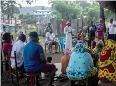  ?? ?? Residents gather for a meeting to create a neighbourh­ood associatio­n and organize patrols to ensure safety in the Kaweni district of Mamoudzou on the French Ocean island of Mayotte.