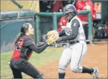  ?? CONTRIBUTE­D PHOTO BY BY CHUCK HUMEL/ELYRIA CHRONICLE TELEGRAM ?? Lebanon’s Savannah Scott scores unconteste­d as Elyria catcher waits for the throw.