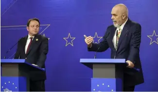  ?? ?? Albania's Prime Minister Edi Rama, right, makes statements with European Commission­er for Neighbourh­ood and Enlargemen­t Oliver Varhelyi