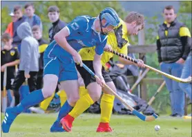  ?? Photo: Iain Ferguson, The Write Image. ?? Kilmallie’s Calum MacDougall and Fort William’s Sean Cruikshank tussle for the ball during last weekend’s Lochaber National Division derby match.