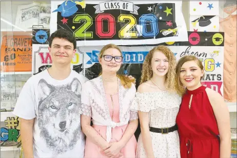  ?? Westside Eagle Observer/SUSAN HOLLAND ?? Cody Funk, Emma Davis, Tabitha Crawley and Valry Rodine, members of the Gravette High School Class of 2020, pose for a photo at a party in their honor on July 11. The graduates enjoyed a buffet meal, opening gifts and cards and visiting with friends and family members who attended.