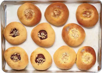  ?? [PHOTO BY DEB LINDSEY, FOR THE WASHINGTON POST] ?? Sweet kolaches filled with Nutella and crushed hazelnuts; with apricot streusel; and with cheese streusel.