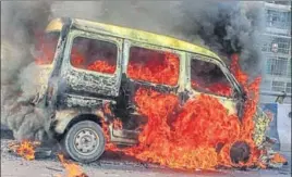  ?? PTI ?? Flames rise out of a burning car after it met with an accident on the Delhigurug­ram Expressway near Shankar Chowk flyover in Gurugram on Friday.