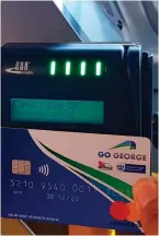  ??  ?? The Smart Card should be held in front of the card reader in this way and not in front of the four green lights, nor the digital window.