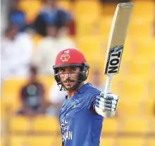  ?? AP ?? Afghanista­n’s Rahmat Shah raises his bat after reaching his half century during the match against Sri Lanka yesterday.