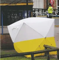  ?? FRANK AUGSTEIN/THE ASSOCIATED PRESS ?? A police tent covers the the spot Monday where former Russian double agent Sergei Skripal and his daughter, Yulia, were found critically ill following exposure to a nerve agent substance in Salisbury, England.