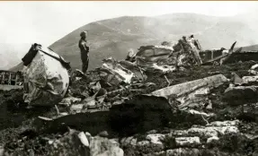 ??  ?? ABOVE: One of the search-and-rescue team amid the debris of the crashed Sunderland in the Scottish Highlands, in August 1942. RIGHT: The Duke of Kent (left) with RAF officers after his appointmen­t as Group Captain, Training Command, in 1940.