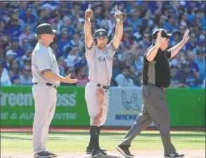  ?? Fred Thornhill / Associated Press ?? Brett Gardner gestures to the Yankee dugout after hitting a triple in the third inning against the Blue Jays on Saturday.