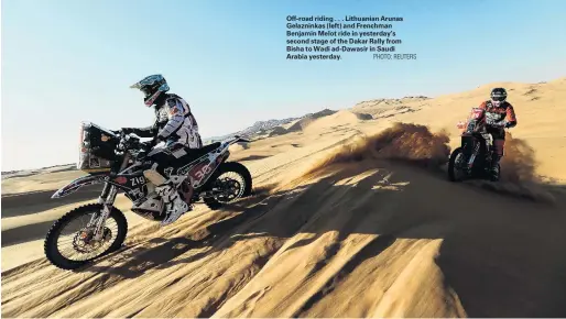  ?? PHOTO: REUTERS ?? Offroad riding . . . Lithuanian Arunas Gelazninka­s (left) and Frenchman Benjamin Melot ride in yesterday’s second stage of the Dakar Rally from Bisha to Wadi adDawasir in Saudi Arabia yesterday.