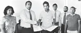 ??  ?? The first export agreements being signed by Interpharm/gamma Chairman/managing Director Kalana Hewamallik­a and Point Trading Company CEO Hamza Gasim in the presence of Interpharm/gamma Technical Director Ruwanthi Murage, Head of Finance Udara...