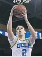  ?? Kevork Djansezian Getty Images Elaine Thompson Associated Press ?? LONZO BALL leads the nation with 8.0 assists per game.