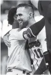  ?? THE ASSOCIATED PRESS ?? Atlanta’s Ender Inciarte, right, celebrates with Ozzie Albies after Saturday’s win against the Miami Marlins in Atlanta. Inciarte walked with bases loaded in the ninth inning to win the game 6-5.