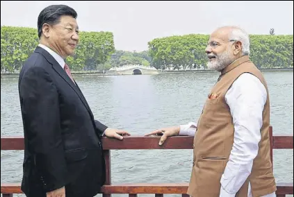  ?? PIB PHOTO ?? Prime Minister Narendra Modi and Chinese President Xi Jinping inside a house boat, in Wuhan’s East Lake, China.