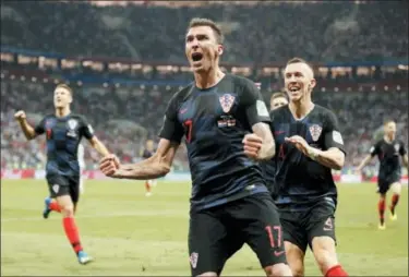  ?? FRANK AUGSTEIN — THE ASSOCIATED PRESS ?? Croatia’s Mario Mandzukic celebrates after scoring his side’s second goal against England on July 1 in Moscow.