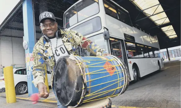  ??  ?? Drumming bus driver Lass Diabate. Picture by Stu Norton.