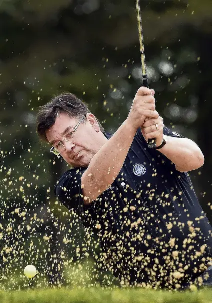  ?? PHOTO: PETER MCINTOSH ?? Bunker blast . . . Andrew Whiley works on his sand game at the Otago Golf Club.