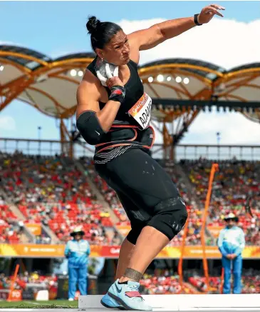  ?? GETTY IMAGES ?? Dame Valerie Adams threw 18.52 metres with her first throw to easily qualify for the women’s shot put final at the Commonweal­th Games on the Gold Coast yesterday.