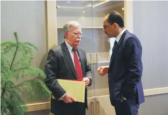  ?? EPA ?? Turkish presidenti­al spokesman and adviser Ibrahim Kalin meets US National Security Adviser John Bolton, left, in Ankara yesterday to discuss the withdrawal of US troops from Syria