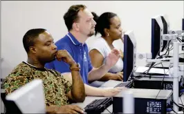  ?? ASSOCIATED PRESS ?? JOB SEEKERS LOOK at their respective computer screens during a resume writing class at the Texas Workforce Solutions office in Dallas Friday.