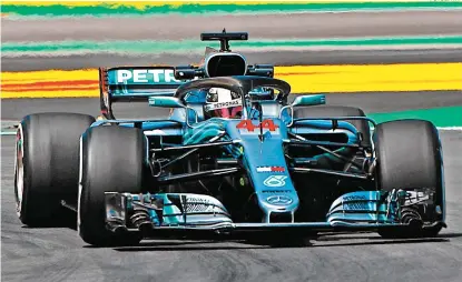  ?? FOTOS: AFP ?? Lewis Hamilton, a bordo de su Mercedes