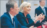  ?? AP/MICHEL EULER ?? New campaign ally Nicolas Dupont-Aignan (left) and far-right candidate for the 2017 French presidenti­al election Marine Le Pen attend a news conference Saturday in Paris.