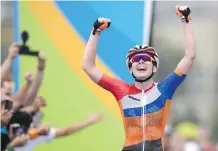  ?? ERIC FEFERBERG/GETTY IMAGES ?? Anna van der Breggen of the Netherland­s, seen celebratin­g after winning the women’s road cycling race on Sunday, says her teammate crashed on a particular­ly “difficult descent.”