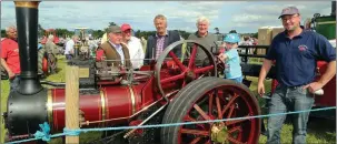  ??  ?? Ivor Deane, Innishanno­n, owner of the Burrell Steam Engine, with Oisín O Callaghan, Ovens, in the drivers seat, and Tom Mulcahy, Carrignava­r, Leonard Mullane, Ballyhooly, and Con Byrnes, Carrignava­r, pictured at last year’s Castletown­roche All Ireland...