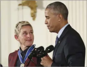  ?? MANUEL BALCE CENETA — THE ASSOCIATED PRESS FILE ?? In this file photo, actress, comedian, and talk show host Ellen DeGeneres, glances at President Barack Obama as she is presented the Presidenti­al Medal of Freedom during a ceremony in the East Room of the White House in Washington. DeGeneres made...