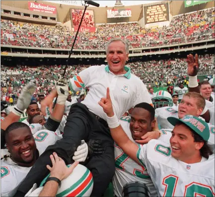  ?? THE ASSOCIATED PRESS — 1993 ?? Miami Dolphins coach Don Shula is carried on his team’s shoulders after his 325th victory, against the Eagles in Philadelph­ia. Shula, who holds the NFL record for coaching victories and led the Dolphins to the only perfect season in league history, died Monday at his South Florida home.