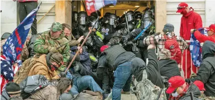  ??  ?? The pro-Trump mob storming the Capitol in Washington DC.