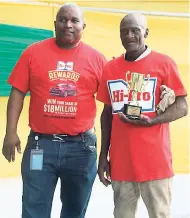  ??  ?? Garfield Russell, Hi-Pro Technical Sales Representa­tive for St Ann & Trelawny, shares lens time with Carlton Smith, Champion Cattle Farmer for 2017.