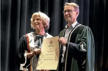  ?? JOHN KIRK-ANDERSON/STUFF ?? Dr Ashley Bloomfield was awarded an honorary fellowship by Royal New Zealand College of General Practice president Dr Samantha Murton.