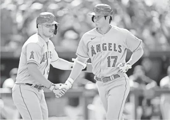  ?? NICK TURCHIARO/USA TODAY SPORTS ?? Mike Trout, left, and Shohei Ohtani are teammates with the Angels but will face off against each other in the World Baseball Classic.