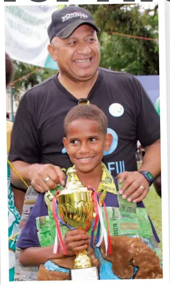  ??  ?? Climate change champions Prime Minister Voreqe Bainimaram­a and one of the country’s youngest climate ambassador­s of Fiji to the COP23 in Bonn, Germany, Timoci Naulusala.