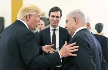  ??  ?? Benjamin Netanyahu on May 22 in Jerusalem. Jared Kushner, center, listens as President Donald Trump talks with Israeli Prime Minister