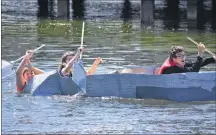  ?? DESIREE ANSTEY/ JOURNAL PIONEER ?? Dillon Boylan just manages to keep his head above the water as Xavier Solamoun, centre, and Dawson Durlsey furiously paddle to the shore while the crowd cheers them on.