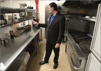  ?? BEN HASTY — MEDIANEWS GROUP ?? Ron DiBenedett­o stands in the renovated kitchen at Devour Catering and Event Design.