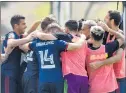  ?? MARK BROWN / GETTY ?? Fire celebrate after a goal by Mauricio Pineda against the Seattle Sounders at the ESPN Wide World of Sports Complex in Lake Buena Vista, Fla., on Tuesday.