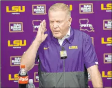  ?? Gerald Herbert The Associated Press ?? Louisiana State football coach Brian Kelly had to be teasing last week when he said there should be a salary cap on athletes’ NIL income — didn’t he?